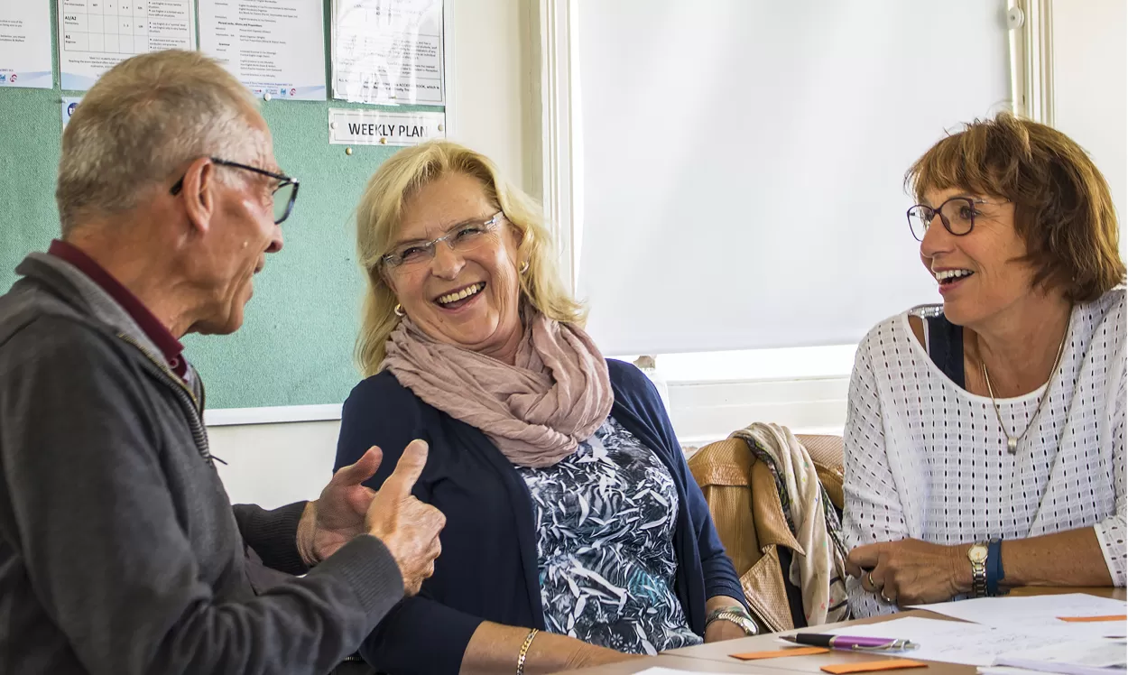 Students share a light-hearted moment during their English for 50+ year old students at ELC Eastbourne.